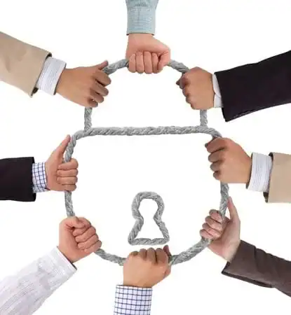 Teamwork and collaboration symbolized by interconnected hands forming a house shape.
