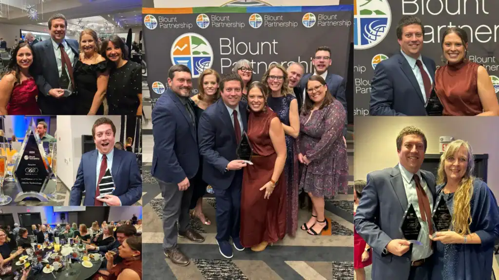 Group of professionals at Blount Partnership event celebrating success.