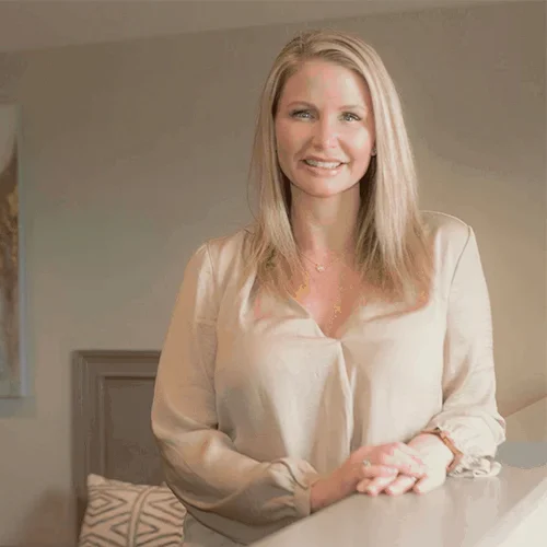 Smiling woman in a professional setting representing client success.