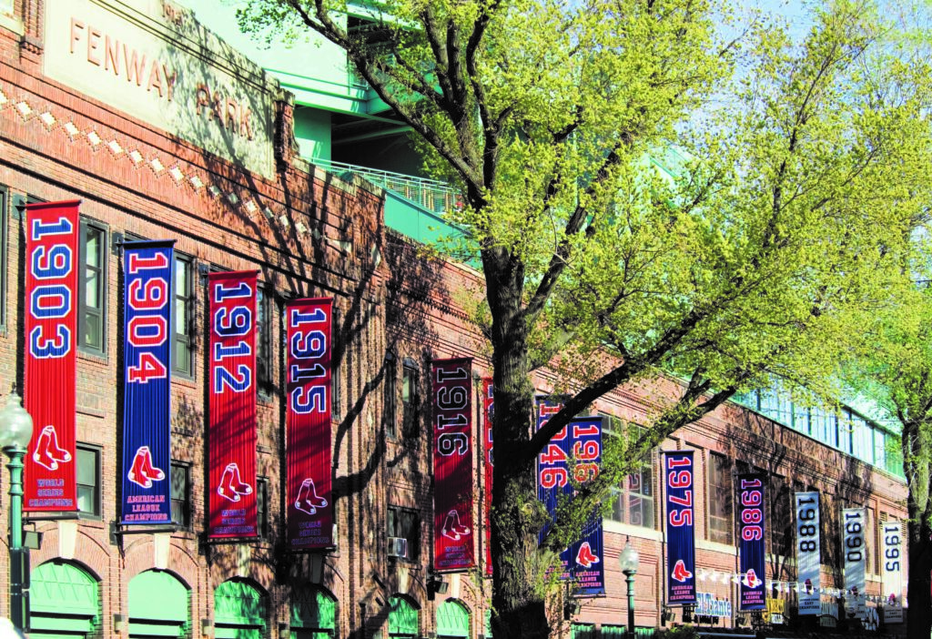 Historic banners at Fenway Park celebrating past championships and team milestones.
