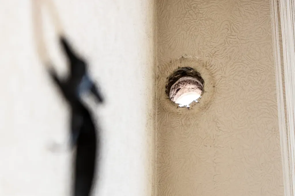 hole in wall of apartment for air conditioner
