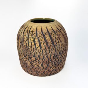 Sculptural stoneware vessel with dense naturally fractured texture and warm earth tones from the Faultline series by Amelia Johannsen