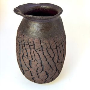 Dark handmade stoneware vase with natural cracked texture, organic rim and minimalist finish by Amelia Johannsen
