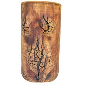 Handmade stoneware vessel with a central fractured copper surface and a bright turquoise glazed interior from the Faultline collection.