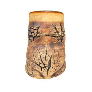 Handmade stoneware vessel with warm copper surface, natural crack patterns and a turquoise glazed interior from the Faultline collection.