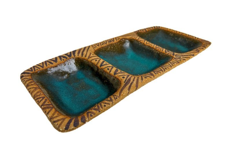 Handmade stoneware ceramic snack dish with three compartments, turquoise glaze, and hand-carved geometric decoration.