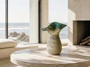 sculptural ocean inspired ceramic vase in a modern beach house interior