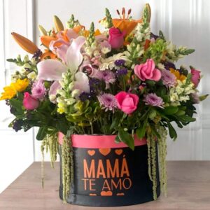 Ramo de flores variadas en tonos rosas, lilas, naranjas y verdes, en arreglo floral elegante para ocasiones especiales, con flores a domicilio en Nezahualcóyotl.