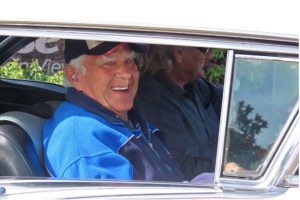 Summerset Resthome 10 Happy older man enjoying classic American car at Americarna event, New Zealand.