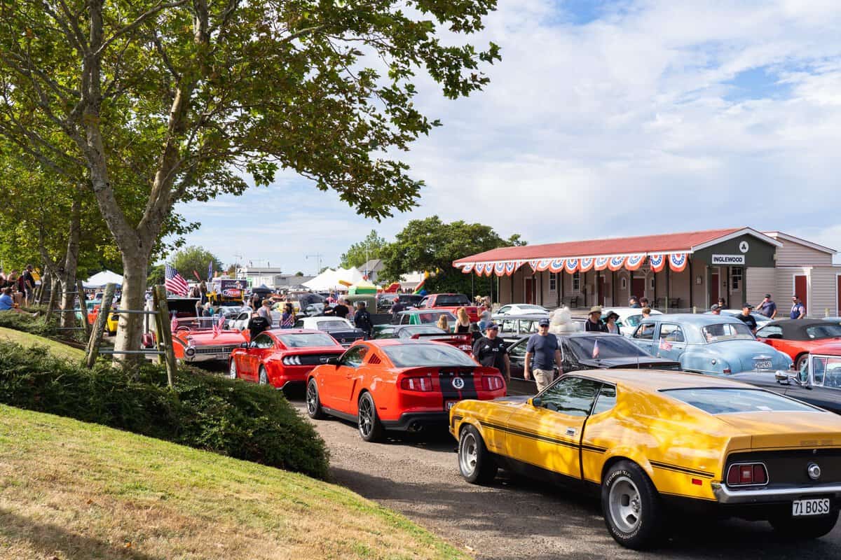 Colourful vintage and classic cars at Americarna car festival in New Zealand, showcasing American muscle cars and automotive culture.
