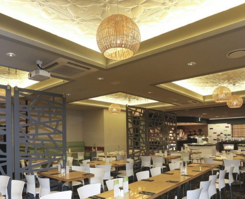 Vibrant American car-themed restaurant interior with modern decor and spacious seating area, perfect for gatherings.