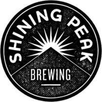 Shining Peak Brewing logo with mountain and sun design, black and white circular emblem.