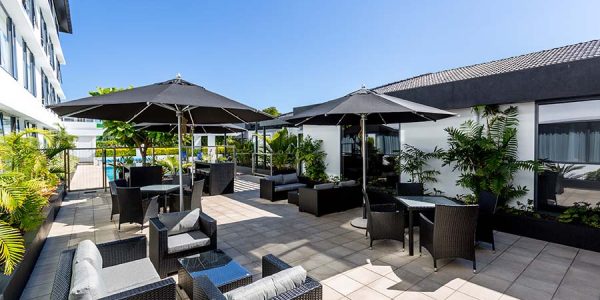 The Plymouth Modern rooftop outdoor lounge with seating and umbrellas at Americarna.