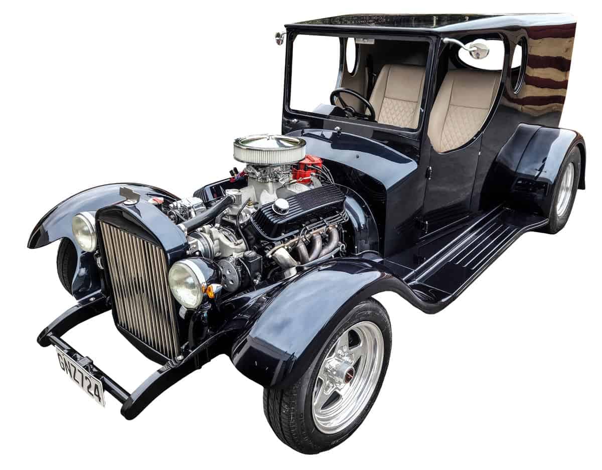 C-cab Vintage black classic car with exposed engine at Americarna event in New Zealand.