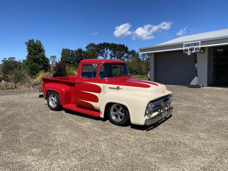 Painted vintage American pickup truck with custom red and cream colour scheme.