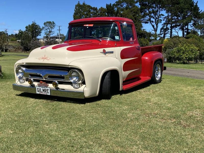 Vintage red and cream customised classic pickup truck at Americarna event.