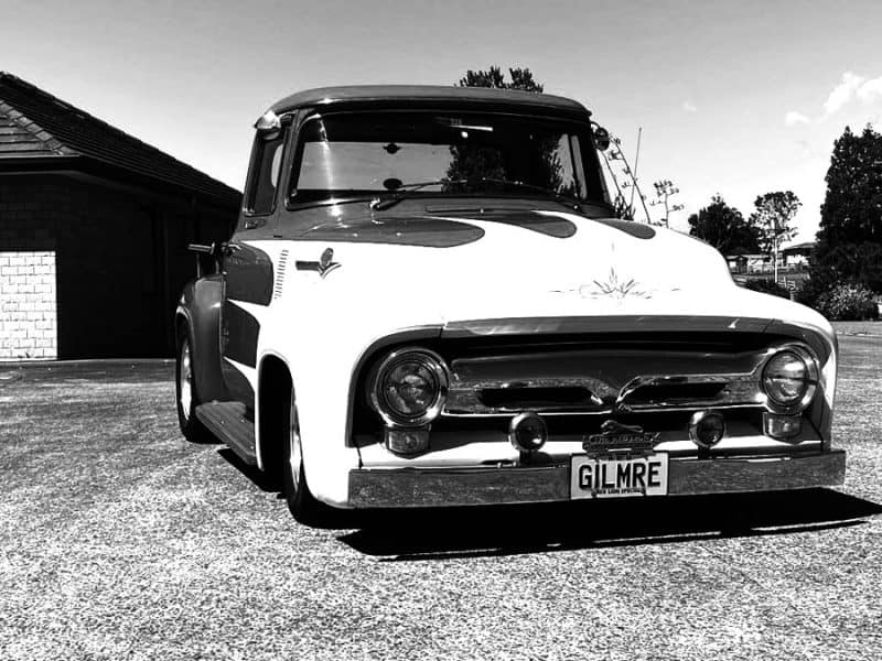 Vintage American pickup truck in black and white for car enthusiasts.