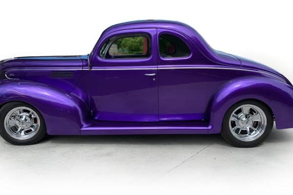 A stunning purple vintage classic car showcased at Americarna car festival in New Zealand.