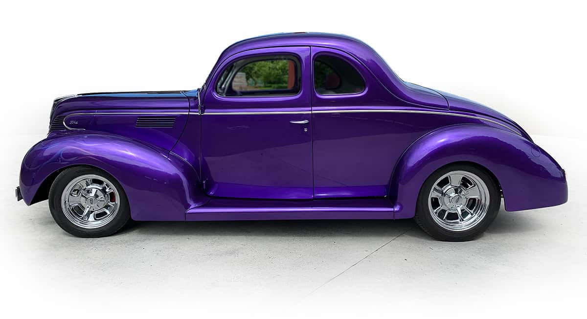 A stunning purple vintage classic car showcased at Americarna car festival in New Zealand.