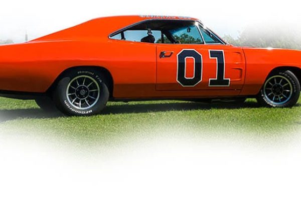 Vintage orange General Lee car from Dukes of Hazzard on display at Americarna. Classic American muscle car with a bold design.