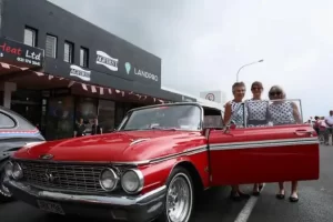 Vintage red classic car at Americarna festival in New Zealand.