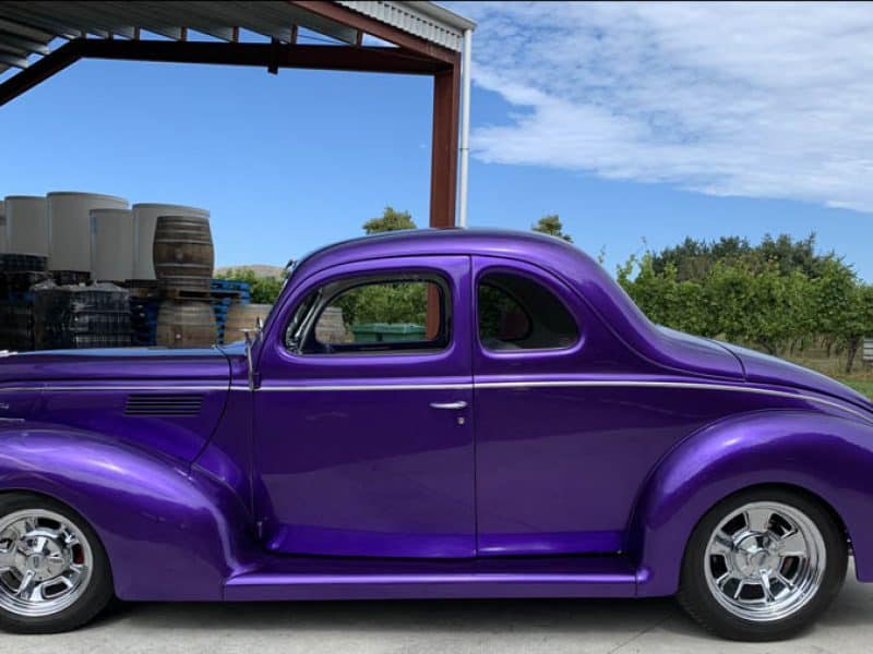 Bright purple classic vintage car at Americarna event NZ.