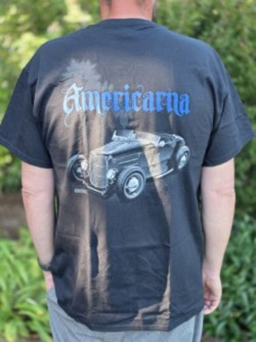 Vintage car graphic on Americarna T-shirt, outdoor event scene.