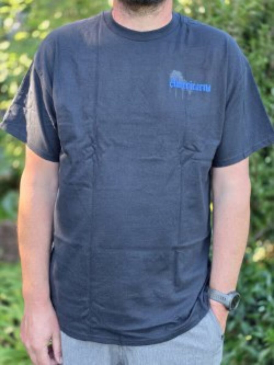 Man wearing Americarna T-shirt at classic car event in New Zealand.