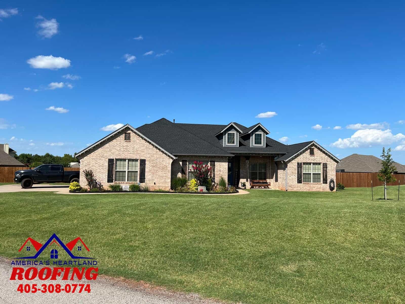 High-quality roofing installation on a spacious suburban home in Oklahoma.