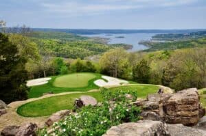 Scenic golf course overlooking a lake.