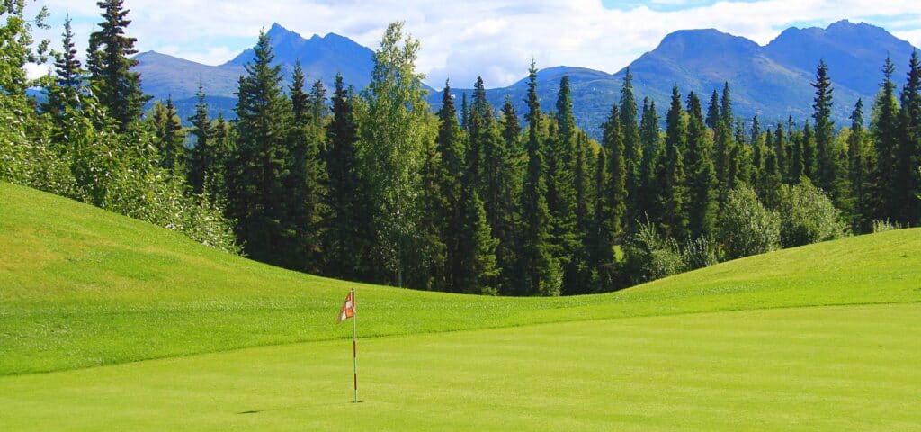 Golf course with mountains in background