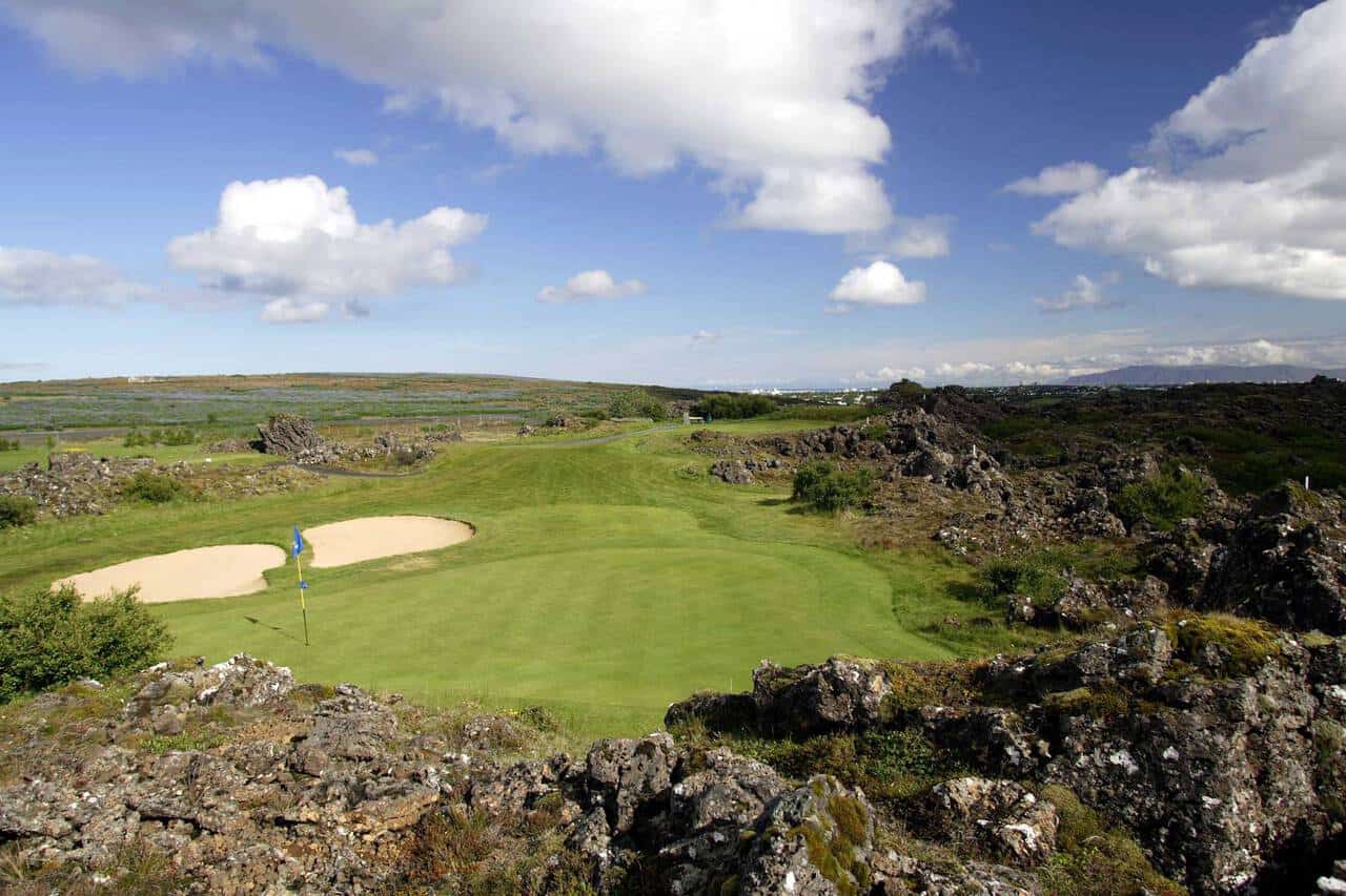 Lush golf course with rocky landscape