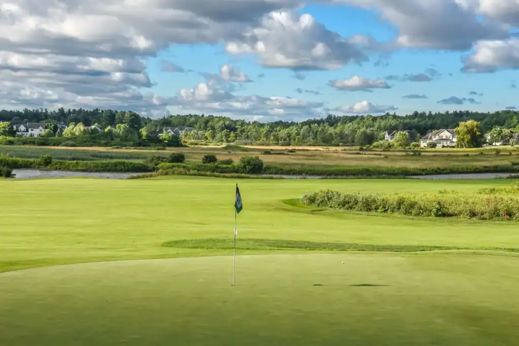 Lush golf course under blue skies