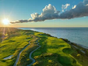 Sunset over lush golf course landscape