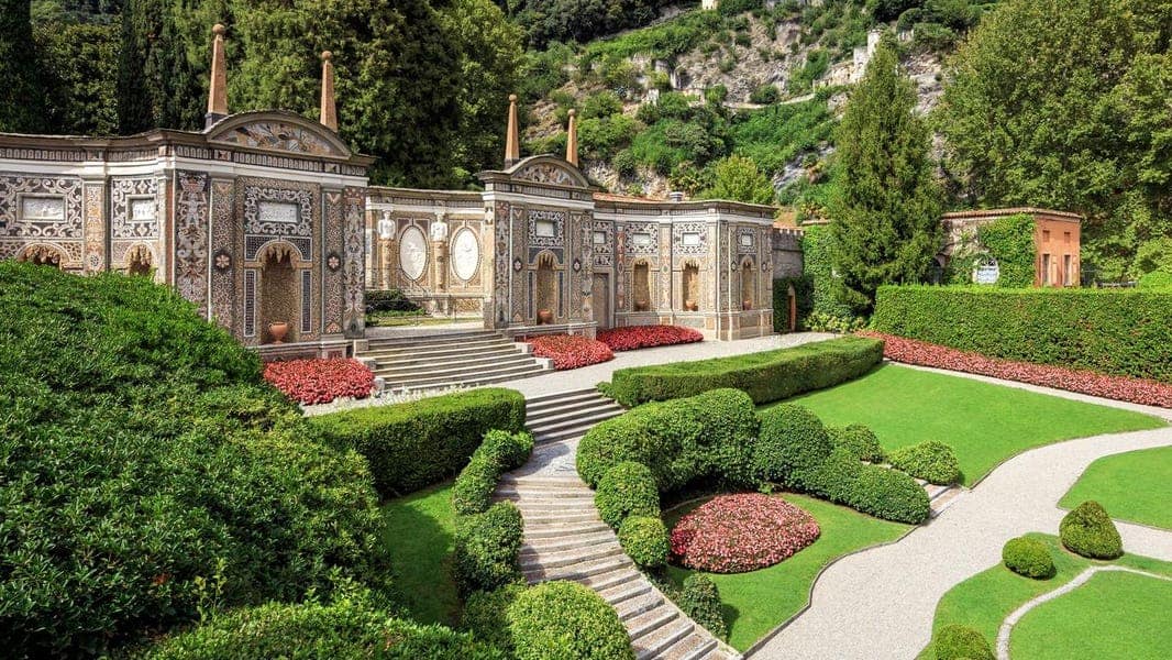 Lush gardens with ornate architecture.