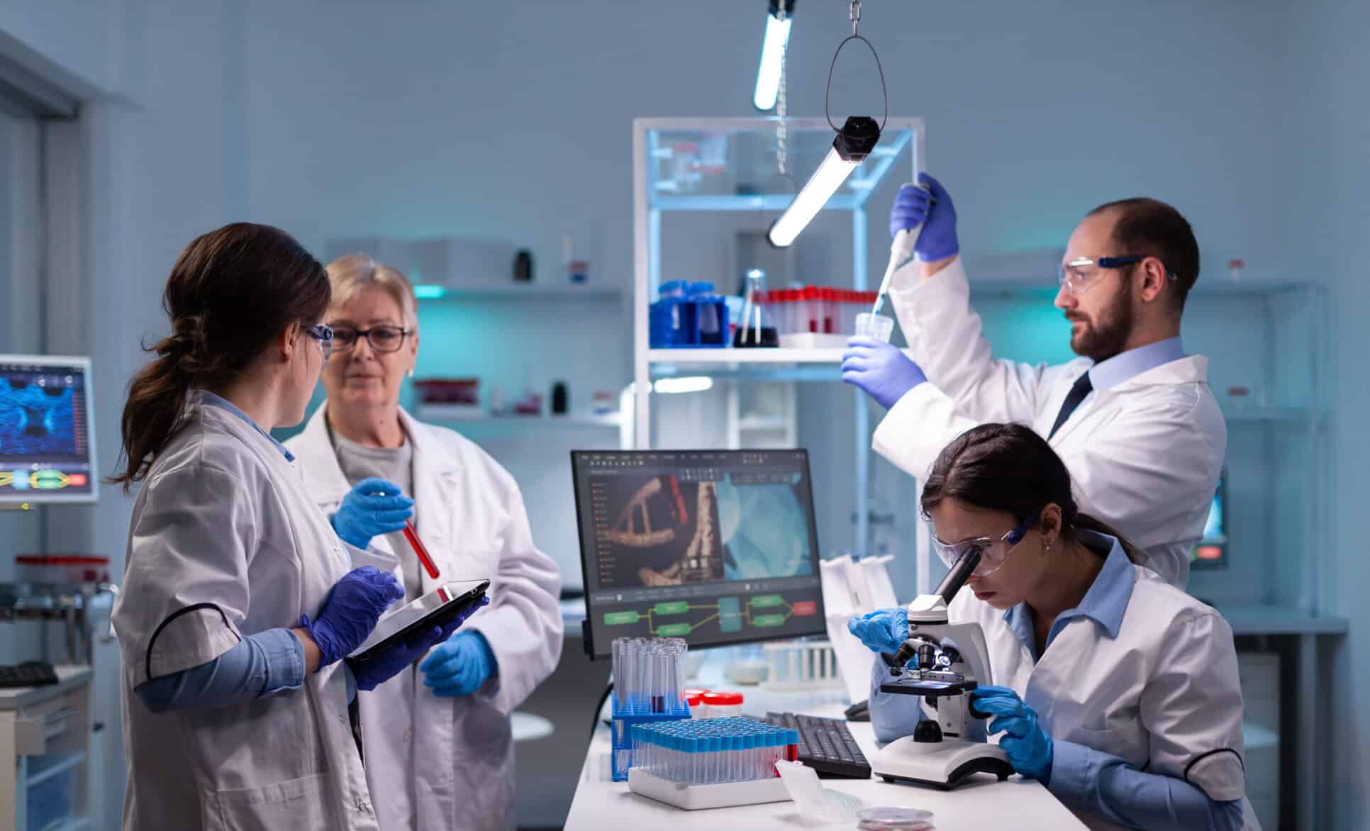 A team of scientists in a modern laboratory conducting research with microscopes, test tubes, and advanced equipment, focusing on amino acids and health supplement development.