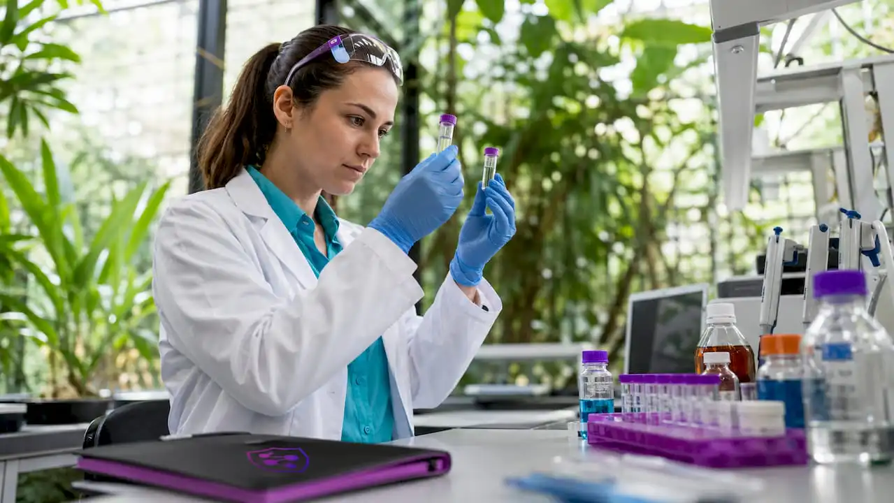 Scientist examining synthetic peptide samples in lab