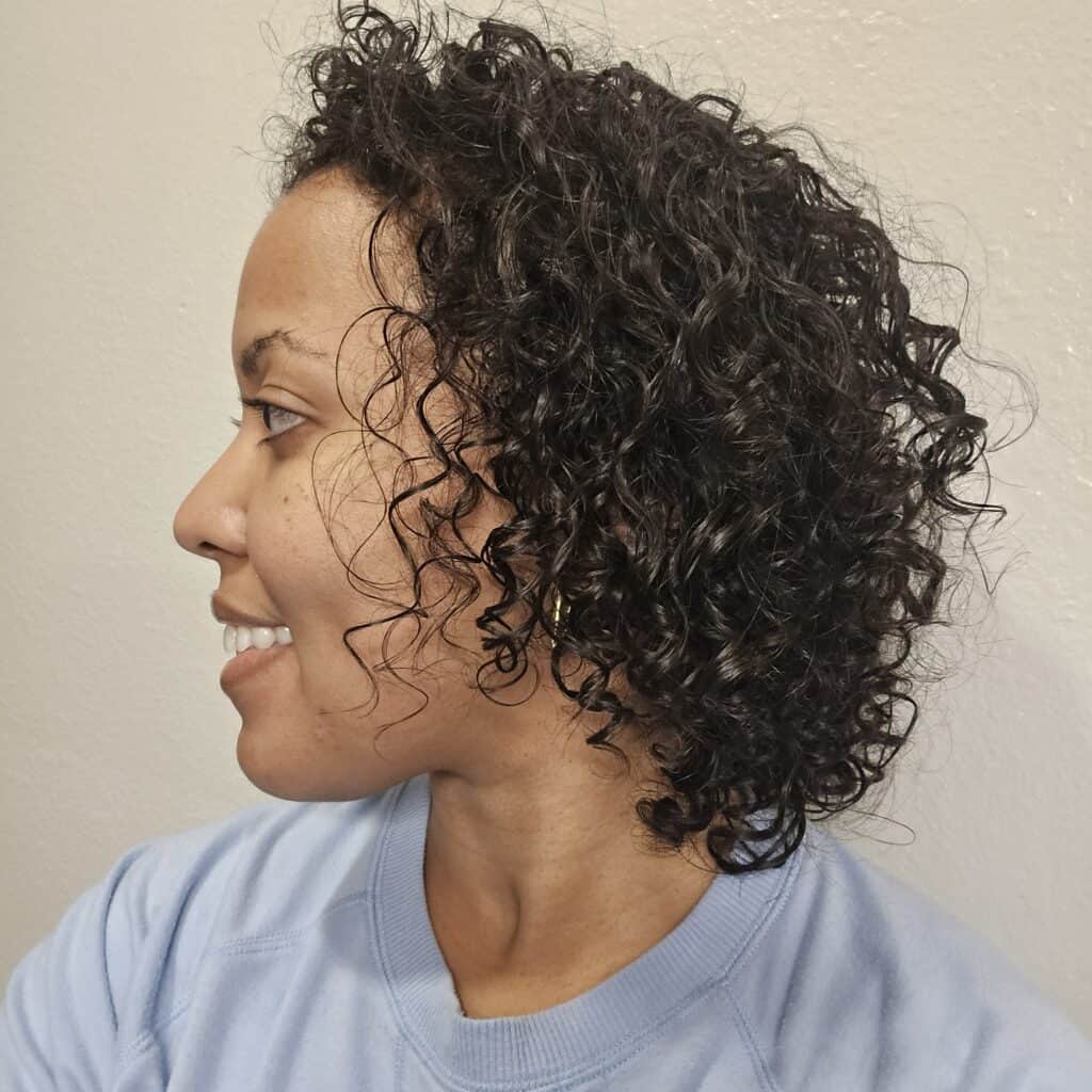 Side view of soft, defined curls post-wash using Obliphica Seaberry routine.