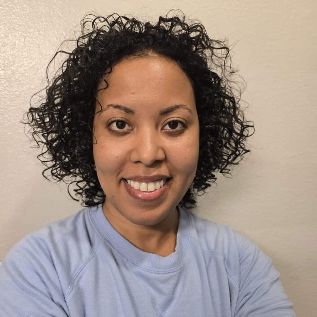 Smiling selfie with freshly styled low-porosity curls after using Obliphica Seaberry products.