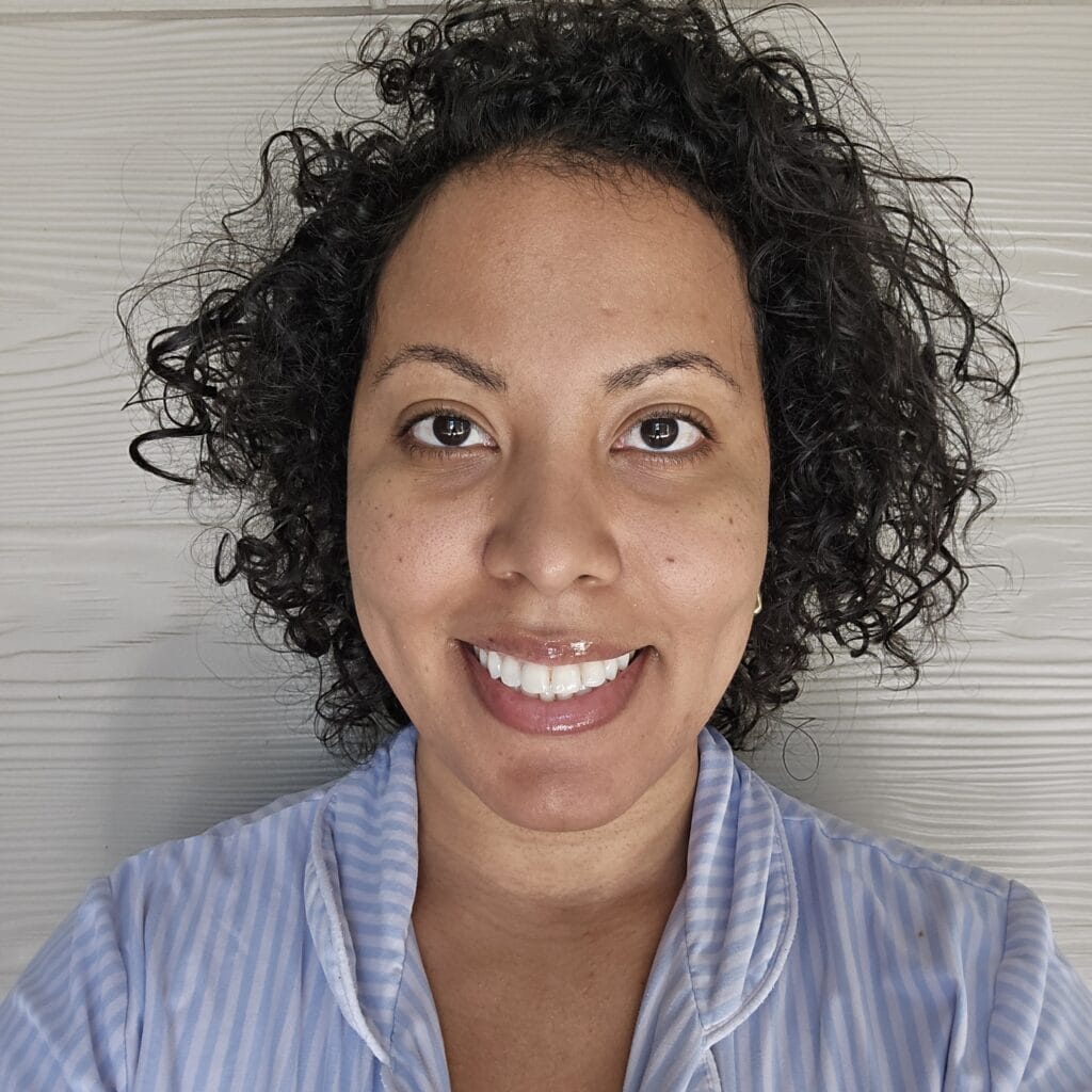 Second-day hair with light frizz and bounce after Obliphica wash day