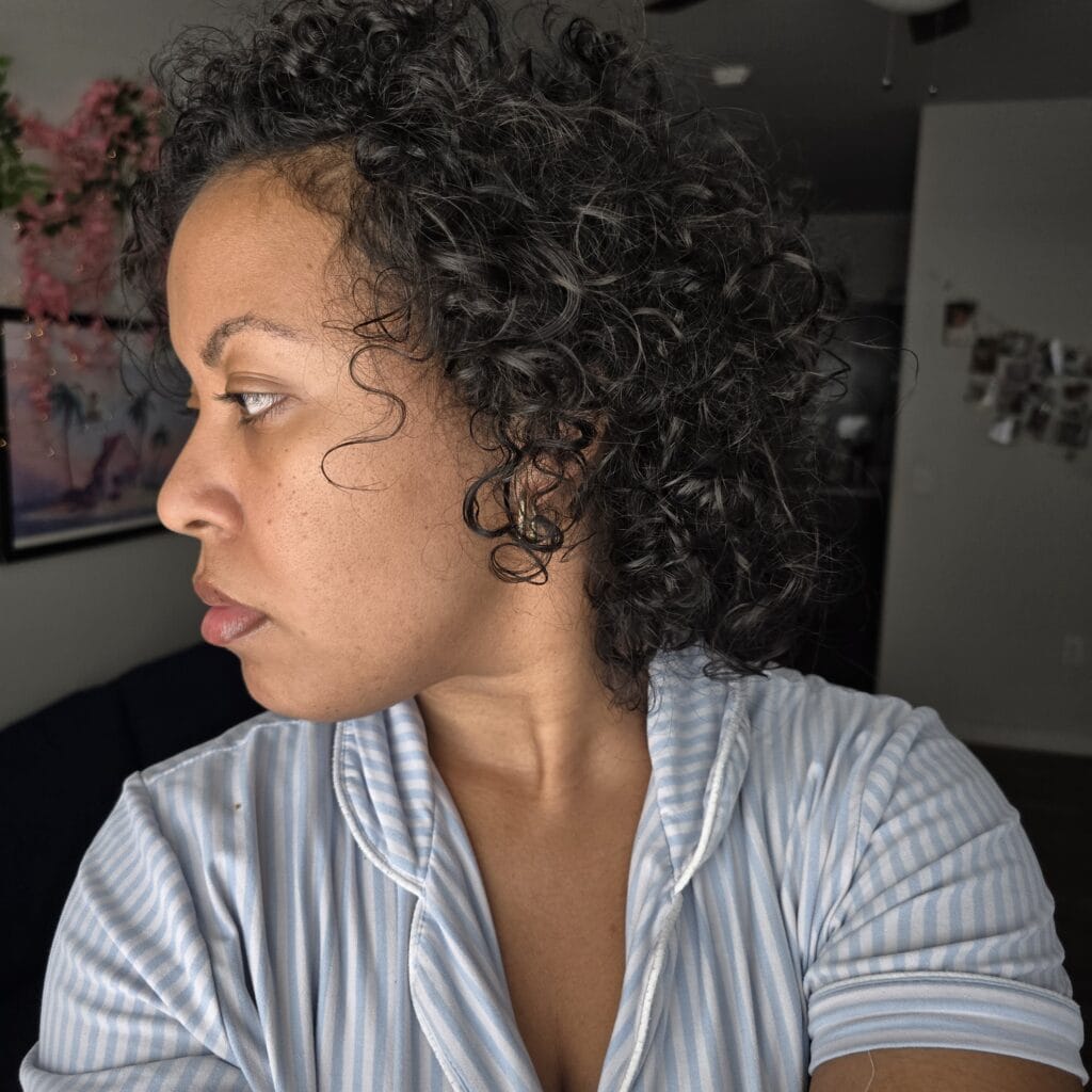 Profile shot highlighting curl definition and volume after styling.