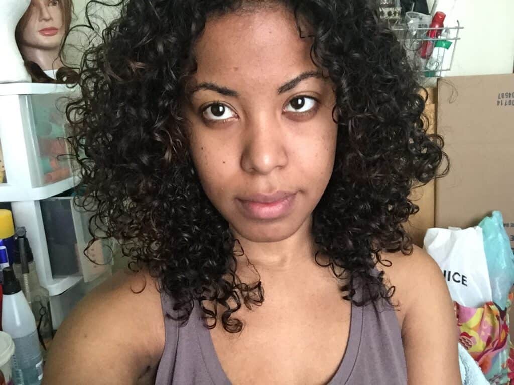 Fresh-faced selfie with soft, springy curls and minimal frizz, styled post-wash