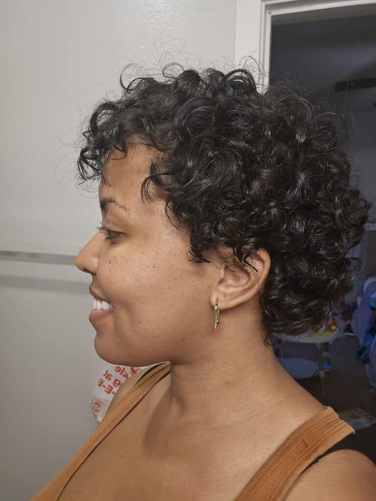 Side profile of short natural curls after completing the big chop