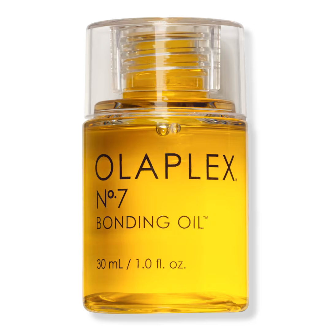 Olaplex No. 7 Bonding Oil in a clear pump bottle filled with golden yellow oil