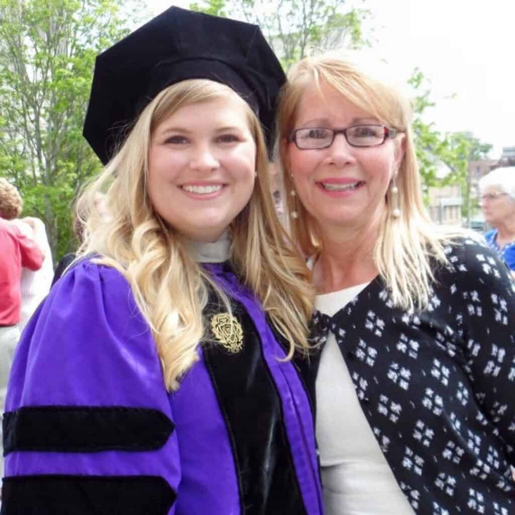Andrea Wegner celebrates earning her Doctor of Audiology degree alongside her mother, one of her strongest supporters throughout her education.
