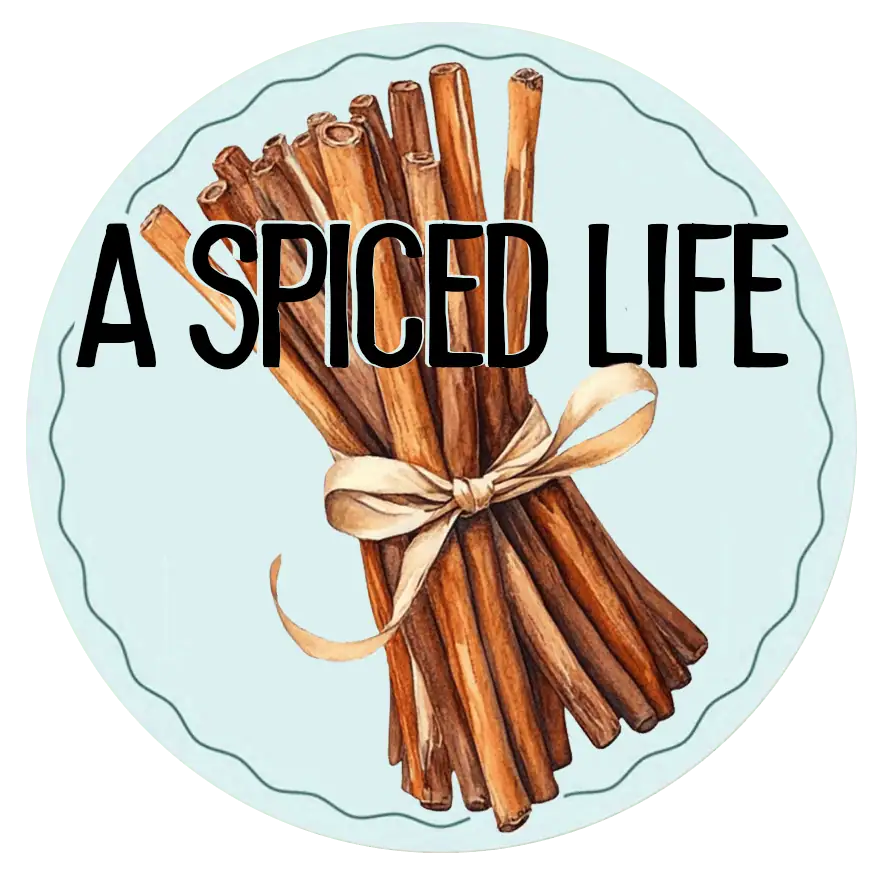 A Spiced Life food blog logo featuring a watercolor bundle of cinnamon sticks tied with a ribbon on a light blue background