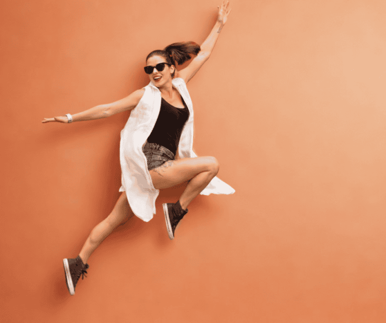 Strong active woman outdoors with overlaid icons representing energy, iron, collagen, immunity and brain function