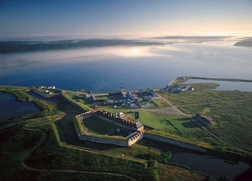 Aerial view of historic Fort Louisbourg overlooking the Atlantic Ocean, showcasing scenic coastal landscapes, colonial architecture, and picturesque waterfront, highlighting Atlantic Destinations tourism in Nova Scotia.