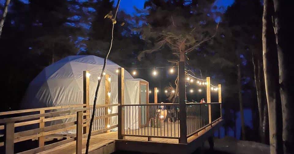 exterior night photograph of a Sissiboo dome all lit up. Nova Scotia glamping domes.