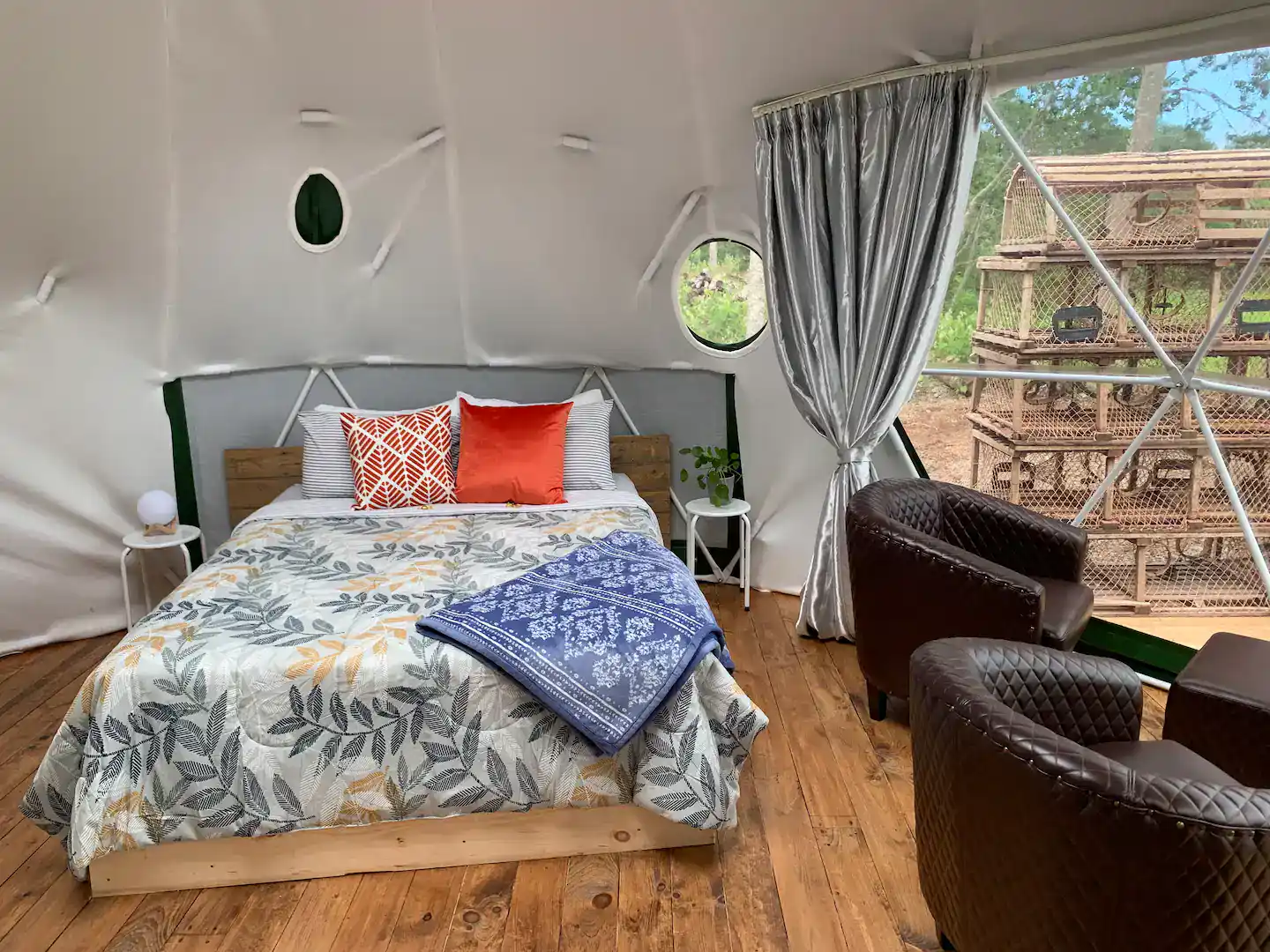 Colorful bed in the dome of the Geodesic Dome Hot Tub Retreat. Nova Scotia glamping domes.